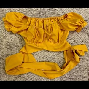 Yellow crop top that wraps around the front and ties in back
